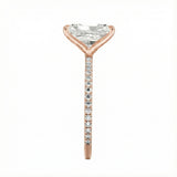 Top-down view of a D-color VVS1 radiant stone in a rose  gold 3/4 pavé setting.