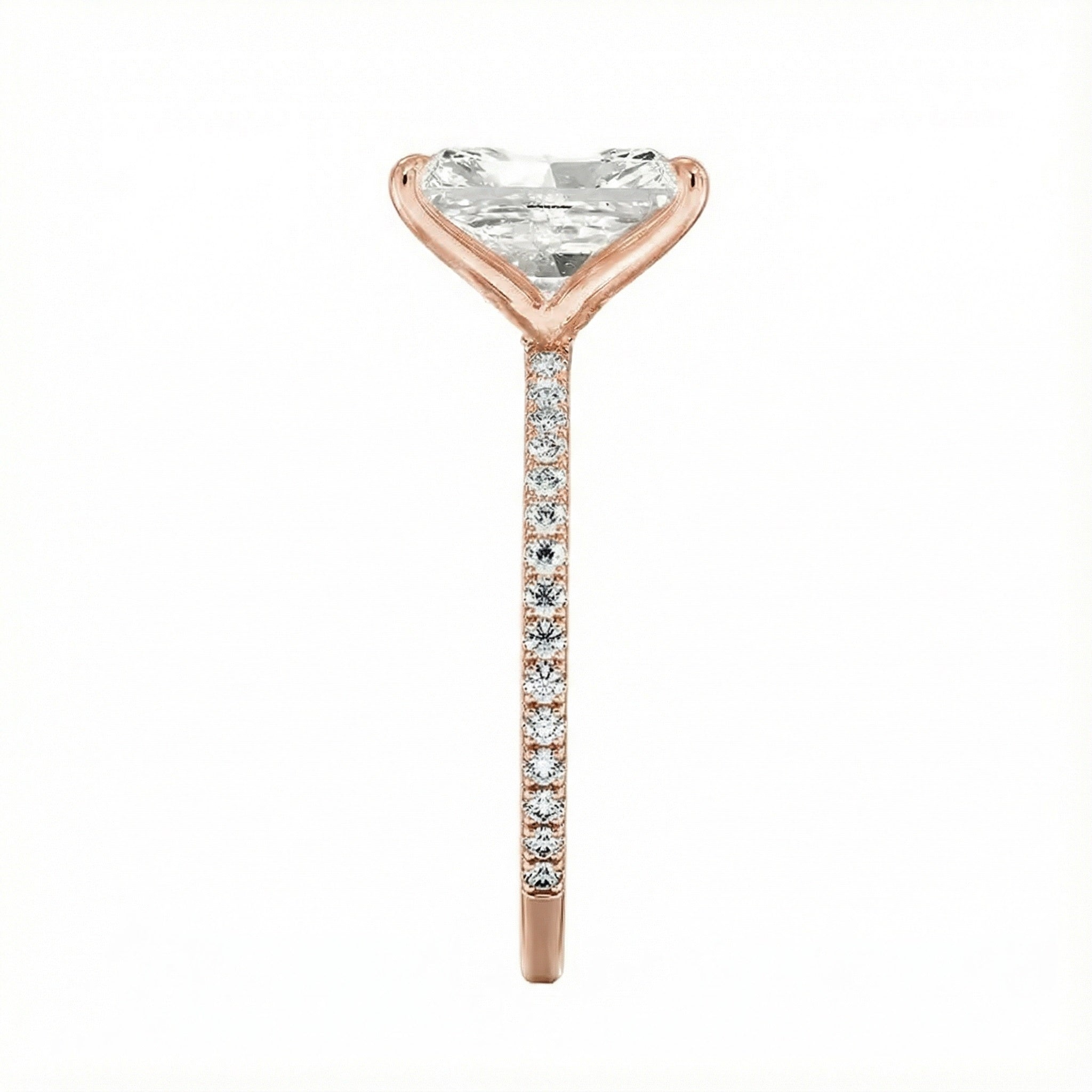 Top-down view of a D-color VVS1 radiant stone in a rose  gold 3/4 pavé setting.