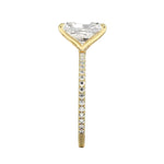 Top-down view of a D-color VVS1 radiant stone in a yellow gold 3/4 pavé setting