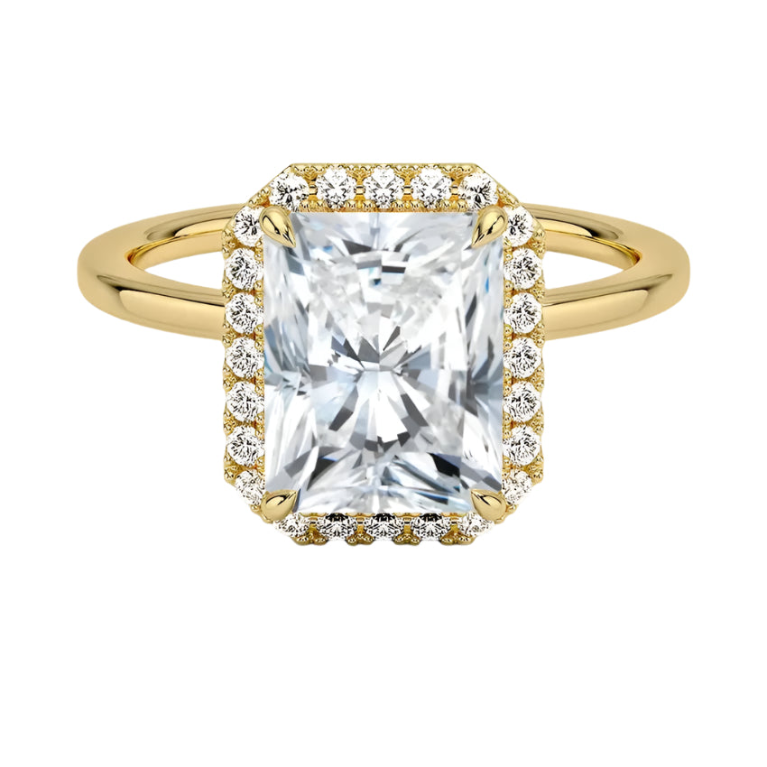 A Halo Radiant Cut Engagement Ring with a large central moissanite stone in a gold setting, surrounded by a halo of smaller moissanite stones.