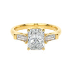 Radiant cut moissanite engagement ring yellow gold three stone tapered baguette