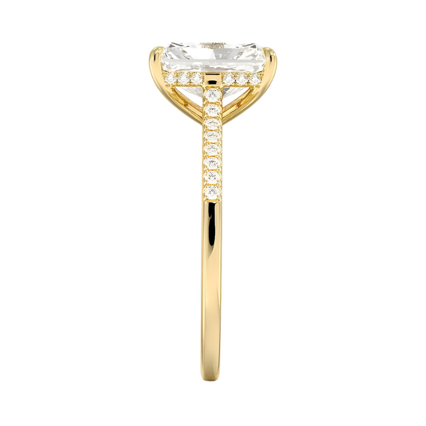 Close-up of the half-pave shank on a yellow gold radiant engagement ring