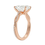 Side profile of the Radiant Infinity Twist ring showing the interlocking smooth and pavé-set gold bands.