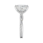 Top-down view of a D-color VVS1 radiant stone in a white gold infinity twist setting.