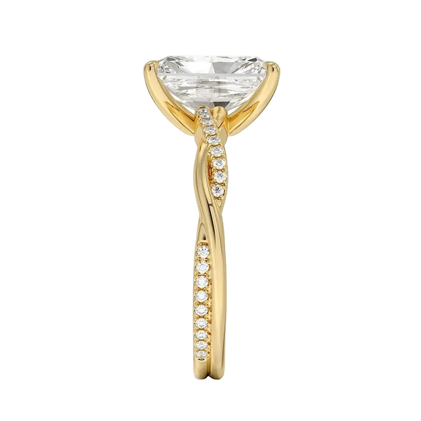 Top-down view of a D-color VVS1 radiant stone in a yellow gold infinity twist setting.