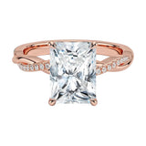 Four-claw radiant cut moissanite engagement ring with a pavé infinity twist vine band in rose gold ApolloGem.