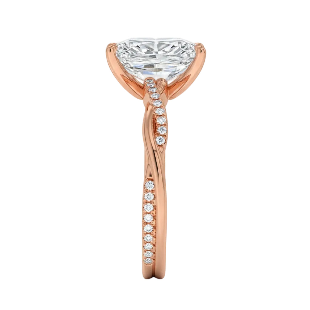Top-down view of a D-color VVS1 radiant stone in a rose gold infinity twist setting.