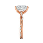 Top-down view of a D-color VVS1 radiant stone in a rose gold infinity twist setting.