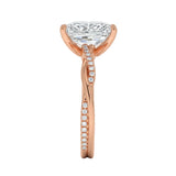 Top-down view of a D-color VVS1 radiant stone in a rose gold infinity twist setting.