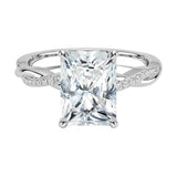 Four-claw radiant cut moissanite engagement ring with a pavé infinity twist vine band in white gold ApolloGem.
