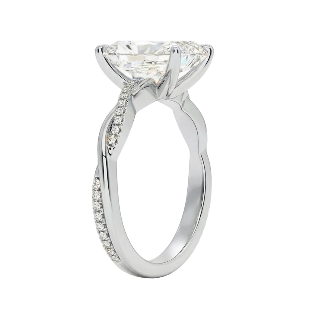 Side profile of the Radiant Infinity Twist ring showing the interlocking smooth and pavé-set gold bands.