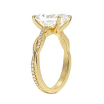 Side profile of the Radiant Infinity Twist ring showing the interlocking smooth and pavé-set gold bands.