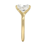 Engagement ring Radiant cut Moissanite lab grown diamond engagement ring v-Split round shank with a four cat-claw setting, on a gold band, against a white background.Moissanite engagement ring cape town south africa grand diamonds ralph jacobs jeulia 