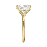 Engagement ring Radiant cut Moissanite lab grown diamond engagement ring v-Split round shank with a four cat-claw setting, on a gold band, against a white background.Moissanite engagement ring cape town south africa grand diamonds ralph jacobs jeulia 