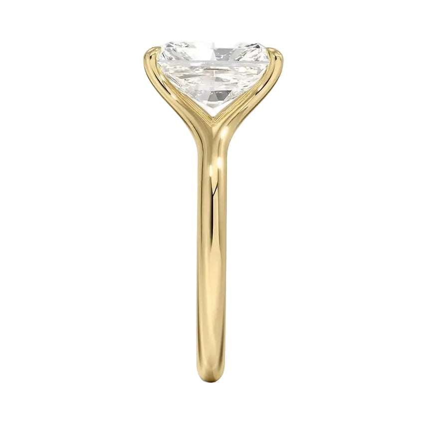 Engagement ring Radiant cut Moissanite lab grown diamond engagement ring v-Split round shank with a four cat-claw setting, on a gold band, against a white background.Moissanite engagement ring cape town south africa grand diamonds ralph jacobs jeulia 
