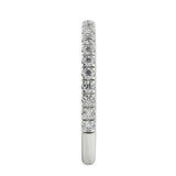 Top-down view of a D-color VVS1 3/4 circle round moissanite wedding band in white gold.