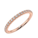 Scattered-style round brilliant moissanite 3/4 eternity band in rose gold ApolloGem.