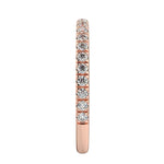 Top-down view of a D-color VVS1 3/4 circle round moissanite wedding band in rose gold.