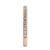 Top-down view of a D-color VVS1 3/4 circle round moissanite wedding band in rose gold.