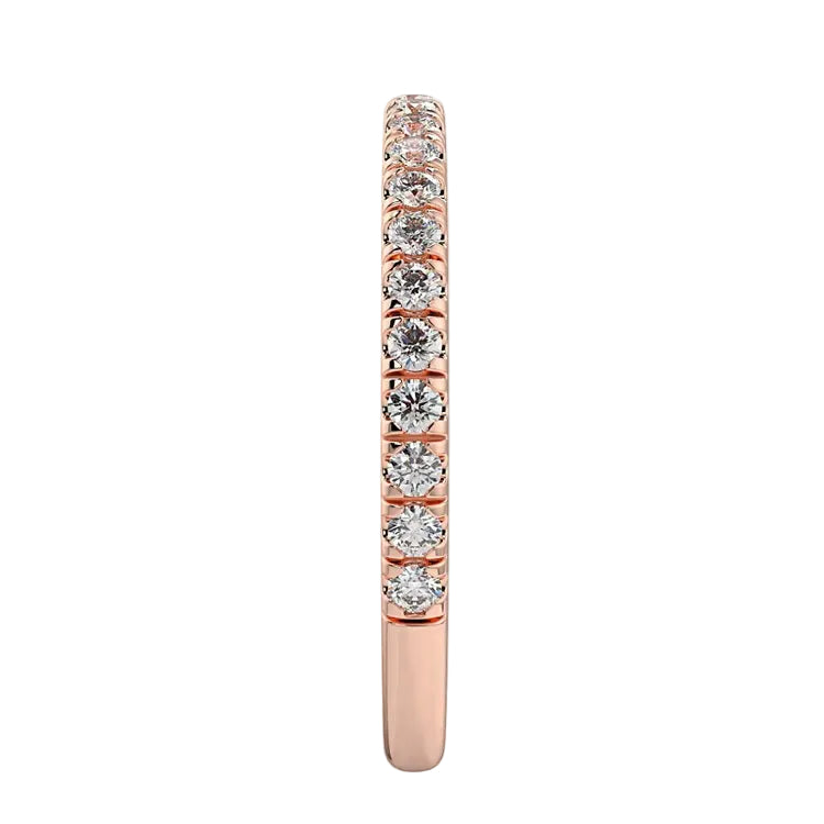 Top-down view of a D-color VVS1 3/4 circle round moissanite wedding band in rose gold.