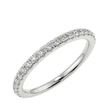 Scattered-style round brilliant moissanite 3/4 eternity band in white gold ApolloGem.
