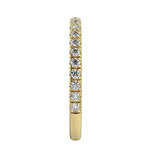 Top-down view of a D-color VVS1 3/4 circle round moissanite wedding band in yellow gold.