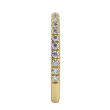 Top-down view of a D-color VVS1 3/4 circle round moissanite wedding band in yellow gold.