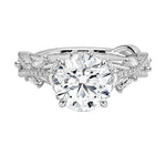 Bespoke round brilliant moissanite engagement ring with a sculpted organic vine band ApolloGem.