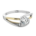 Close-up of a D-color VVS1 round moissanite secured by a contemporary white gold wrap.