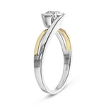 Symmetrical top-down view of a round moissanite in a decorative two-tone gold wrap setting.