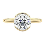 Luxury round brilliant moissanite engagement ring with an open-tube bridge setting in yellow gold ApolloGem.