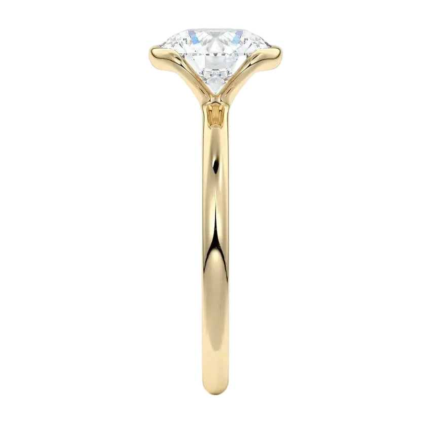 Engagement ring Round cut Moissanite lab grown diamond engagement ring  with open tube setting, on a gold band, against a white background.Moissanite engagement ring cape town south africa grand diamonds ralph jacobs jeulia 