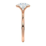 Engagement ring Round cut Moissanite lab grown diamond engagement ring  with open tube setting, on a gold band, against a white background.Moissanite engagement ring cape town south africa grand diamonds ralph jacobs jeulia 