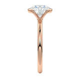 Engagement ring Round cut Moissanite lab grown diamond engagement ring  with open tube setting, on a gold band, against a white background.Moissanite engagement ring cape town south africa grand diamonds ralph jacobs jeulia 