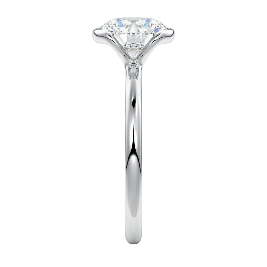 Engagement ring Round cut Moissanite lab grown diamond engagement ring  with open tube setting, on a gold band, against a white background.Moissanite engagement ring cape town south africa grand diamonds ralph jacobs jeulia 