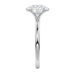 Engagement ring Round cut Moissanite lab grown diamond engagement ring  with open tube setting, on a gold band, against a white background.Moissanite engagement ring cape town south africa grand diamonds ralph jacobs jeulia 
