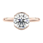 Luxury round brilliant moissanite engagement ring with an open-tube bridge setting in rose gold ApolloGem.