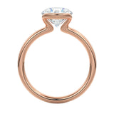 Engagement ring Round cut Moissanite lab grown diamond engagement ring  with open tube setting, on a gold band, against a white background.Moissanite engagement ring cape town south africa grand diamonds ralph jacobs jeulia 