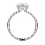 Engagement ring Round cut Moissanite lab grown diamond engagement ring  with open tube setting, on a gold band, against a white background.Moissanite engagement ring cape town south africa grand diamonds ralph jacobs jeulia 
