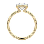 Engagement ring Round cut Moissanite lab grown diamond engagement ring  with open tube setting, on a gold band, against a white background.Moissanite engagement ring cape town south africa grand diamonds ralph jacobs jeulia 