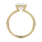 Engagement ring Round cut Moissanite lab grown diamond engagement ring  with open tube setting, on a gold band, against a white background.Moissanite engagement ring cape town south africa grand diamonds ralph jacobs jeulia 
