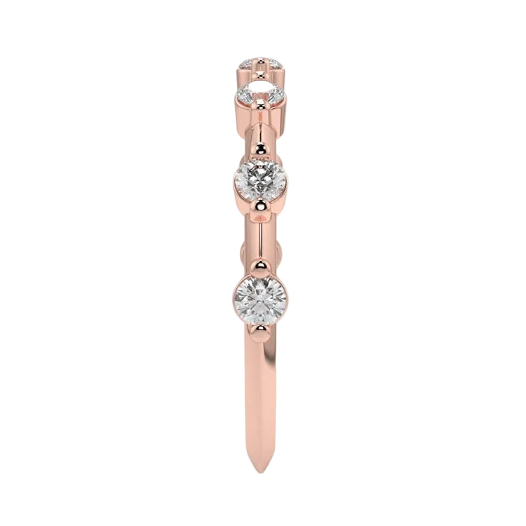 Top-down view of a D-color VVS1 2.0mm round stone bezel-set band in rose gold.