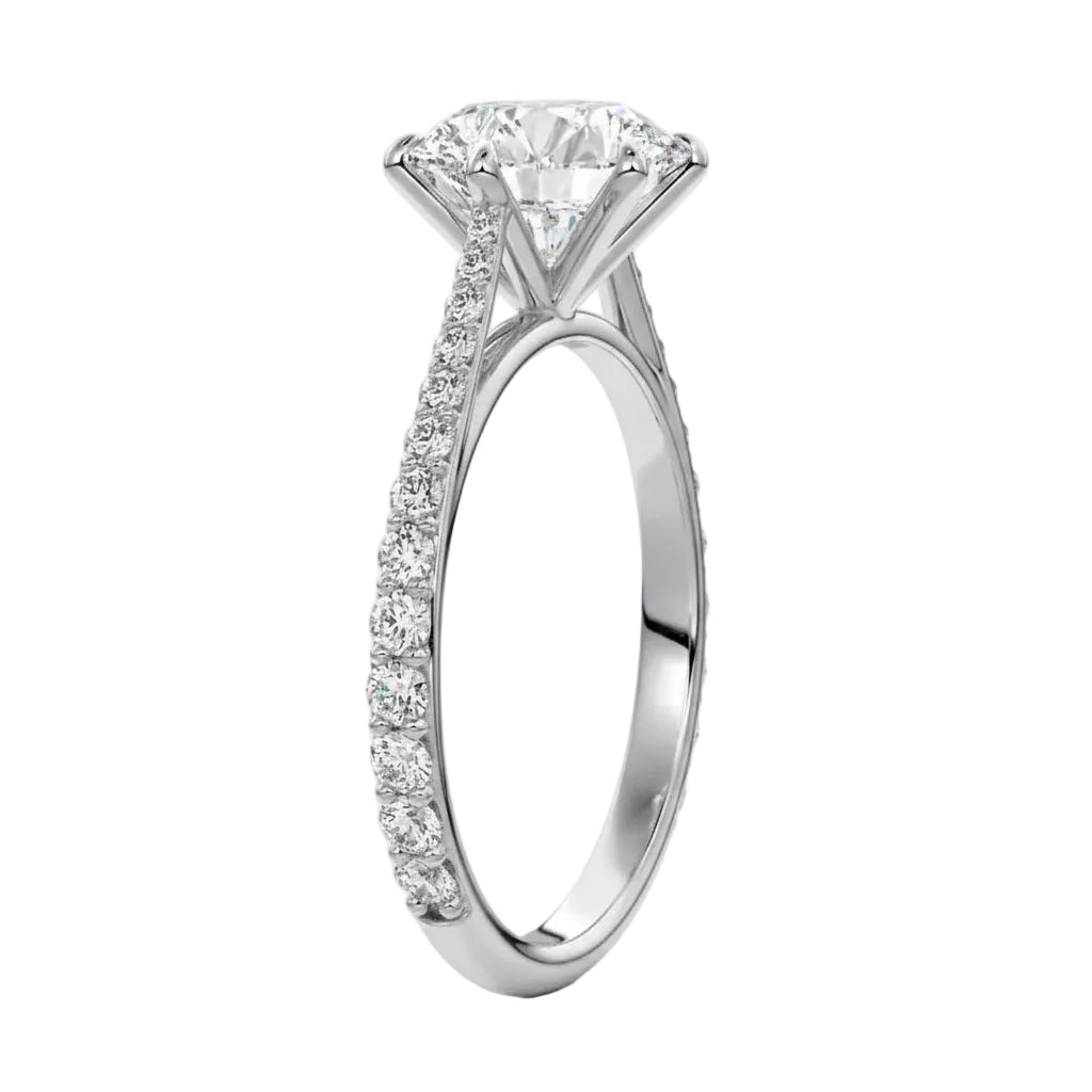 Top-down view of a D-color VVS1 round stone in a white gold six-prong cathedral setting.