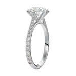 Top-down view of a D-color VVS1 round stone in a white gold six-prong cathedral setting.