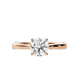 Close-up of a D-color VVS1 round moissanite held by elegant, sophisticated cathedral prongs.