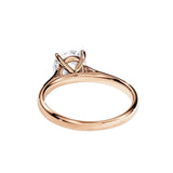 Detailed side view showing the architectural cathedral arches and secure 4-prong moissanite setting.