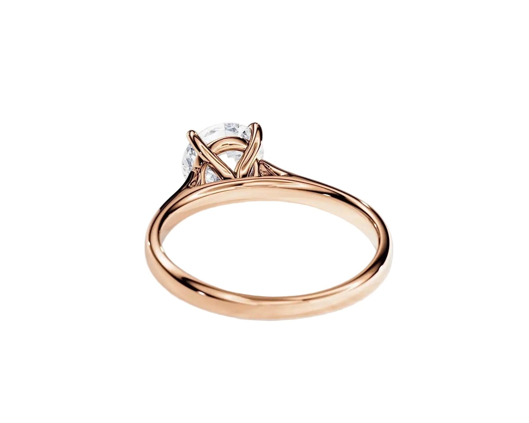 Detailed side view showing the architectural cathedral arches and secure 4-prong moissanite setting.