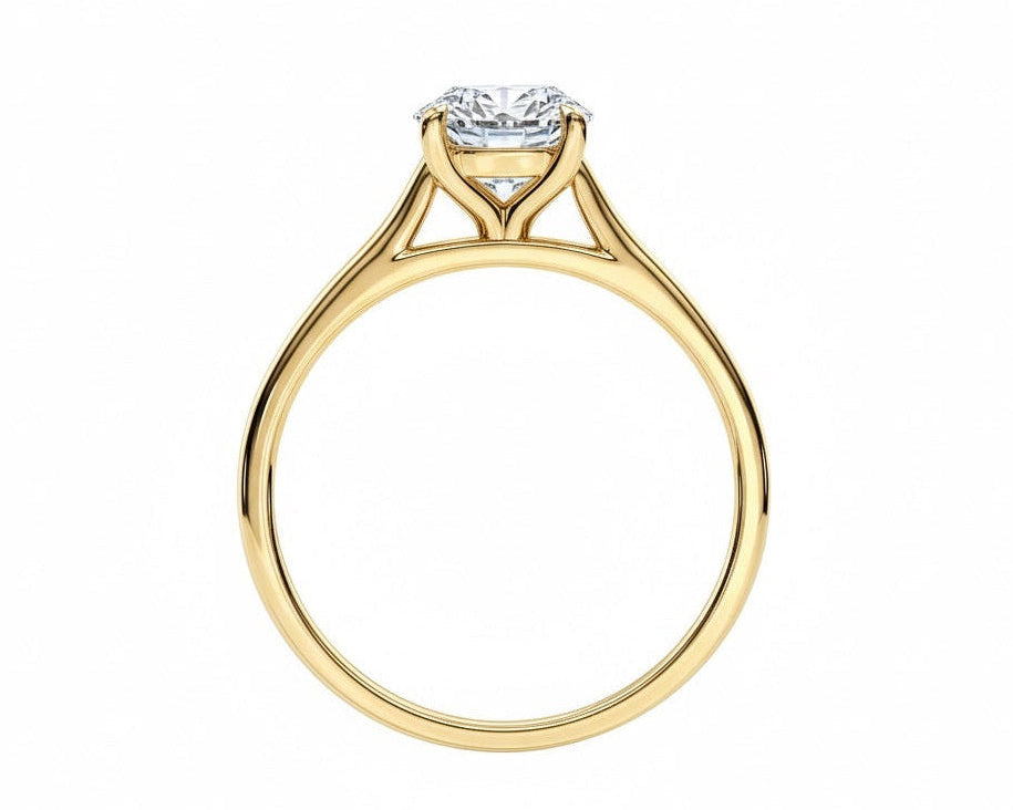 Symmetrical top-down view of a round moissanite solitaire in a polished yellow gold cathedral setting.
