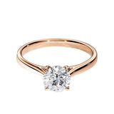 Close-up of a D-color VVS1 round moissanite held by elegant, sophisticated cathedral prongs.