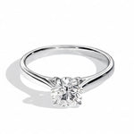 Close-up of a D-color VVS1 round moissanite held by elegant, sophisticated cathedral prongs.